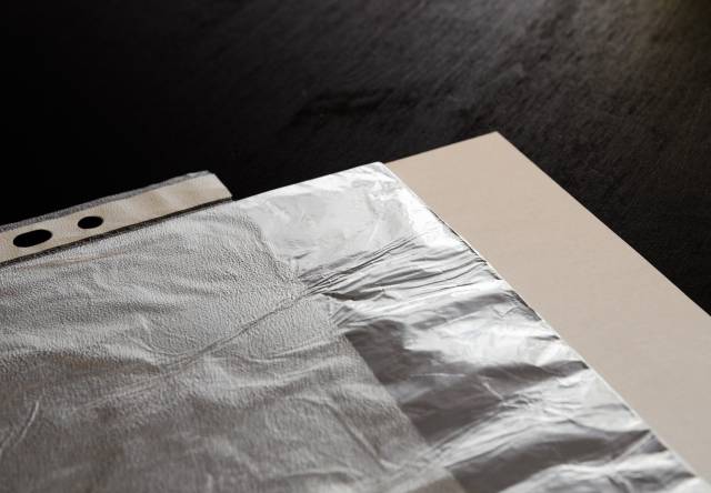 Slide things into the sheet protector. Et voilà.